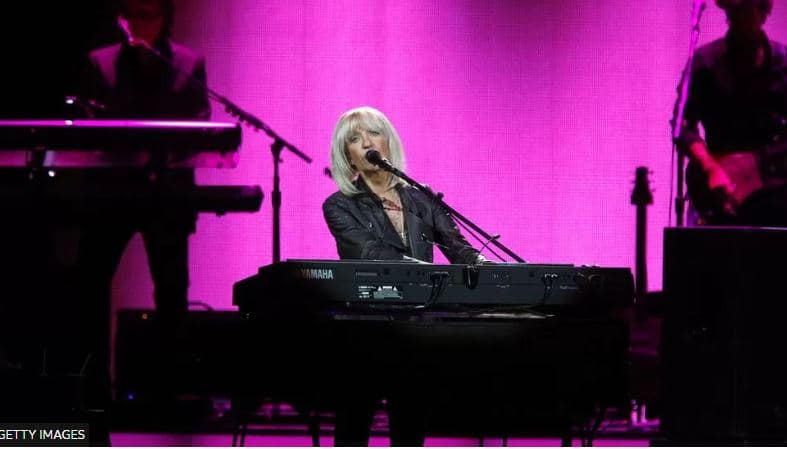 Vdes Christine McVie, anëtare dhe tekstshkruese e grupit "Fleetwood Mac"